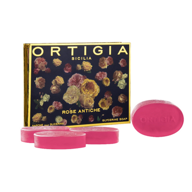 Pink soap with floral packaging labeled 'Ortigia' on a white background